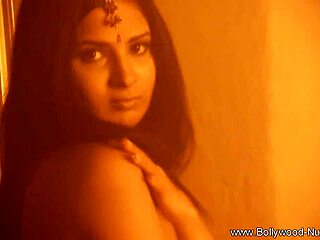 Lovely brunette dances gracefully in solo striptease performance