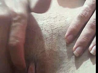 Essa puta novinha shows small tits and wet hairy pussy without panties on street