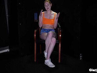 Big tittied redhead babe deepthroats and handjobs huge cocks through gloryhole walls