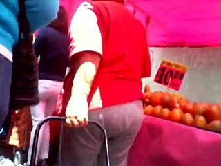 curvy woman in jeans walking down the street in casual outfit