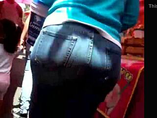 curvy woman in jeans walking down the street in casual outfit