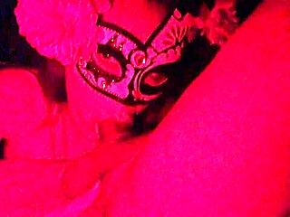 Why is she masked in red light while sucking that cock?
