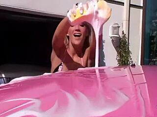 Seductive Car Washing Leads to Blonde Lesbos in Outdoor Threesome with Strapons and Pussy Licking
