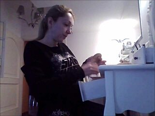 Amateur with big tits goes topless in hidden cam footage. She burps while doing makeup in voyeur reality style.