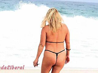 Bold blonde Latina milf flashes big ass in micro bikini on Rio beach for public exhibitionist thrill