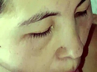 Korean wife performs close-up blowjob on husband with natural tits visible