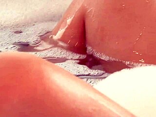 Beautiful asian lesbian with pierced nipples enjoys fingering and licking in jacuzzi with cute redhead brunette