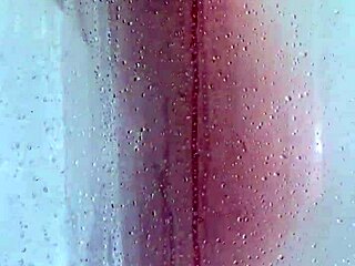 watch her big ass and tits bounce wildly in this explicit shower scene with shaved pussy action!