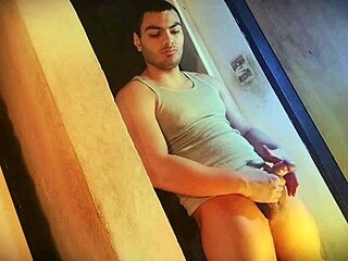 Muscular man with big cock presses against the wall with sexy pelvic moves