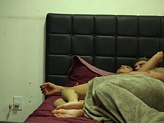 What happens when crossdressing friends secretly film a young newbie getting intimate at home under the covers