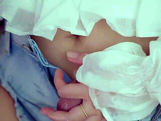 an older asian woman explores her hairy pussy with hands rubbing before deciding on insertion to hold back cum