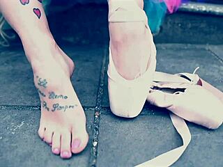 Ballerina in ballet shoes walks barefoot down the street