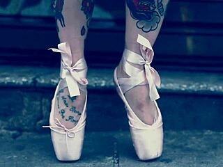 Ballerina in ballet shoes walks barefoot down the street
