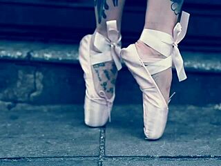 Ballerina in ballet shoes walks barefoot down the street