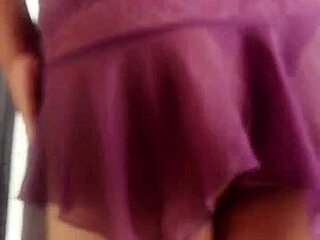 Transvestite displays outfits in a detailed modeling sequence