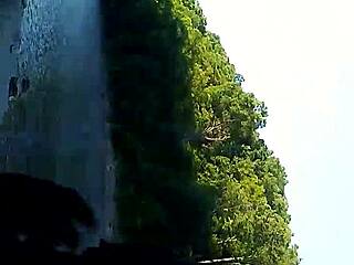 Bent over interracial blowjob in public outdoors