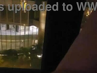 teasing my clit by the hotel window for all to see