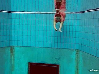 Deniska strips shaved teen body underwater