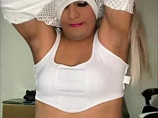 Rica Angelita parades her lush transsexual breasts in tempting display