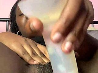 Ebony babe creams pretty shaved pussy solo