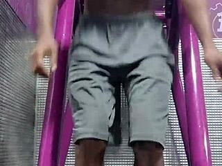 athletic brunette uses machine in dorm workout room