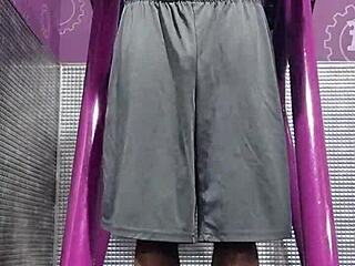 athletic brunette uses machine in dorm workout room