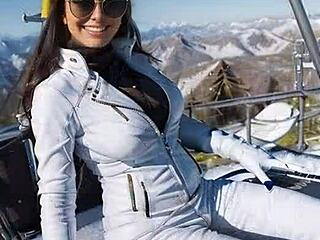Leather catsuit babe jerks off in snowy public ski resort