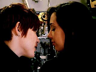 A SEXY BRUNETTE POUNDED BY REDHEAD'S STRAPON COCK