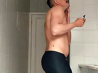 Sexy Guy Boldly Shaves Legs In Black Beach Shorts