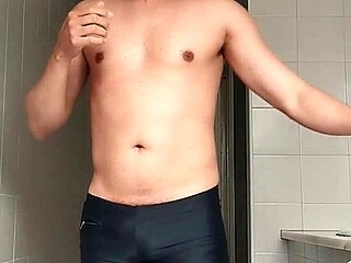 Sexy Guy Boldly Shaves Legs In Black Beach Shorts