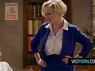 dee williams spends time with two students in the library