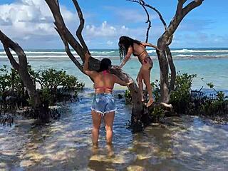 Two pretty young Latinas kiss on Enseada dos Corais beach Cabo PE