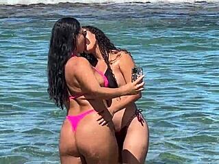 Two pretty young Latinas kiss on Enseada dos Corais beach Cabo PE