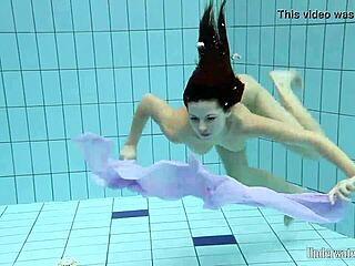 Aneta’s Big Tits Shine In Pool Dress