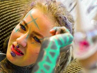 check out this tattooed babe's solo anal dildo play in fishnets heels and stockings