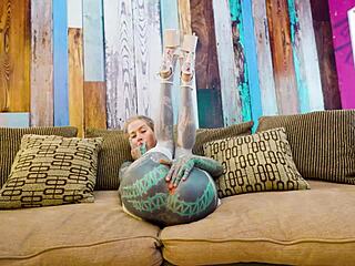 check out this tattooed babe's solo anal dildo play in fishnets heels and stockings