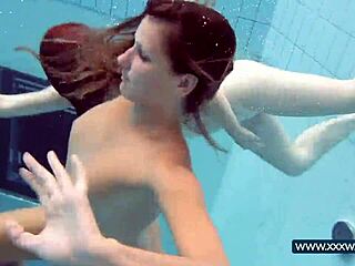 katrin and lucy flaunt massive tits underwater at russian beach pool