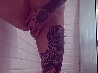 submissive tattooed slut showers her juicy big pussy lips