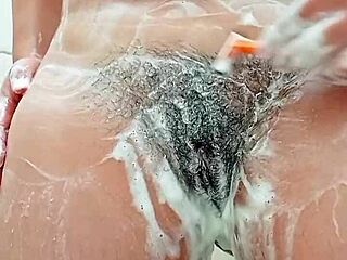 Young Brunette Shaves Hairy Pussy Close in Bathroom