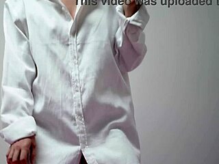 cute brunette housewife smokes playful in bra and blouse