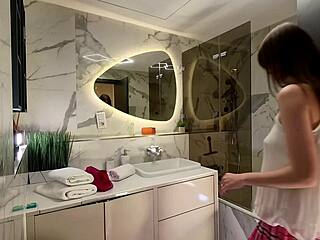 long legged nerdy coed flashes pink skirt and panties in bathroom