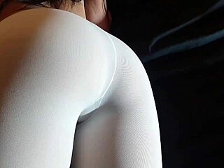 Milf's big firm ass stretches white pantyhose while teasing in sexy heels.
