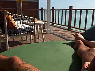 hot babe's sloppy handjob on ocean terrace balcony