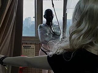 bondage babe in 1mm rubber mask and latex catsuit mummified outdoors
