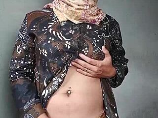 Asian hijab ladyboy strokes cock in solo masturbation session
