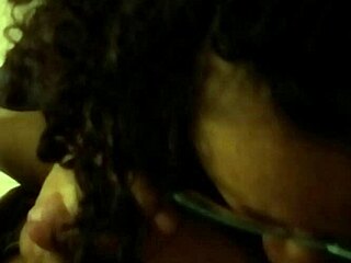 Curly haired girl sucks cock on hidden cam