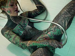 Tattooed model fingers gaping ass in steamy shower