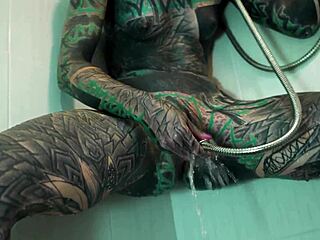 Tattooed model fingers gaping ass in steamy shower
