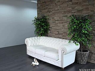 hey wendy moon poses naked in heels glasses on sofa for photoshoot