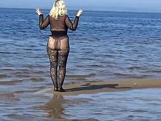 black style flashing on the beach in pantyhose
